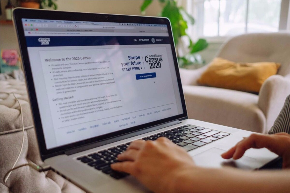 Laptop open with Census 2020 website open.