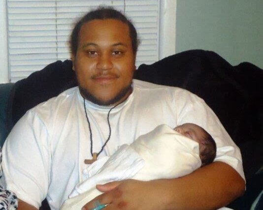 Ryan Stokes with his newborn daughter, Neriah. She is now 8 years old. Courtesy of Narene Stokes