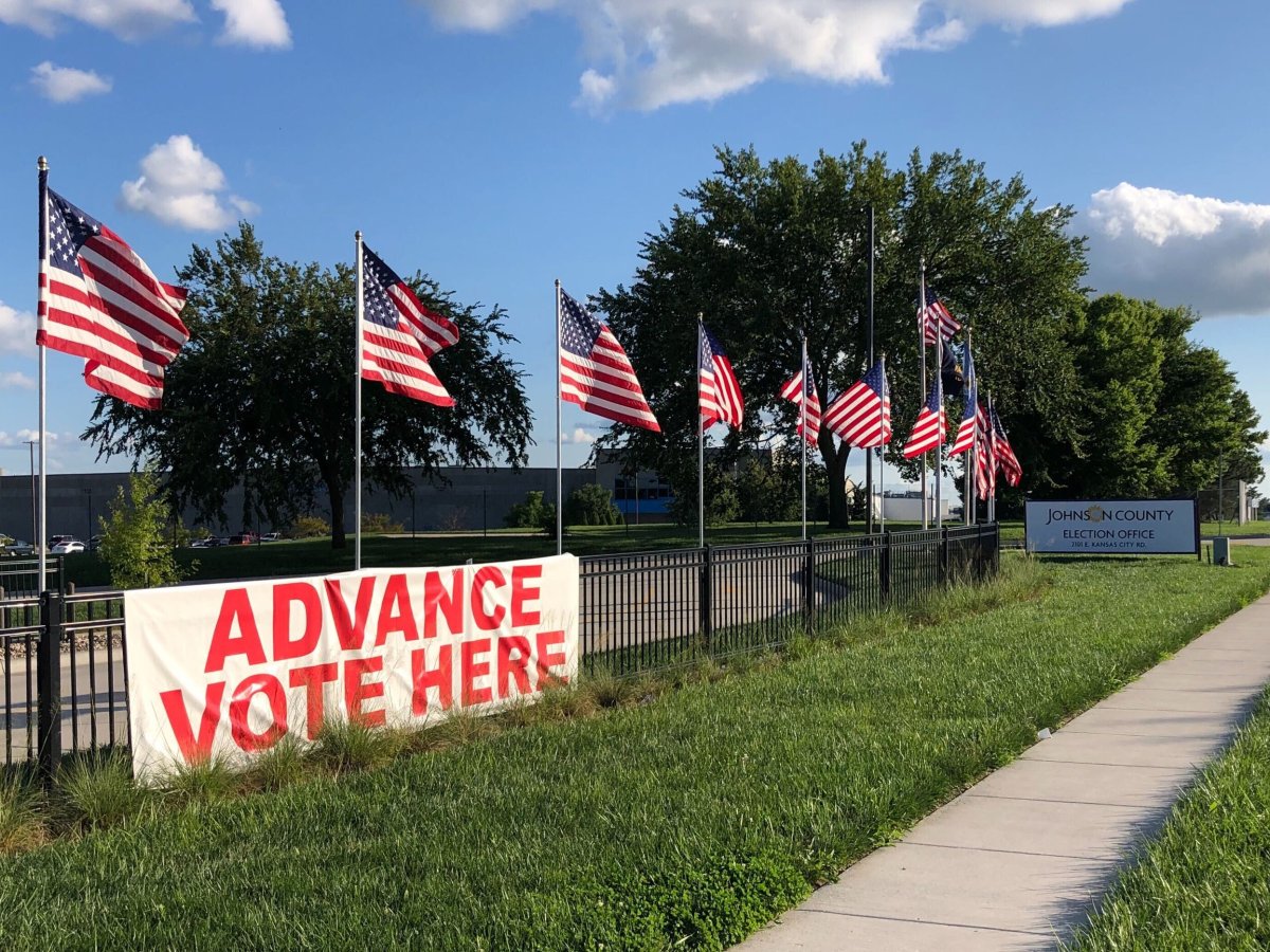A sign on a fence in Kansas reads "Advance Vote Here." All Kansan voters are eligible to vote by mail; the last day to request a mailed ballot is Oct. 21. (Kelsey Ryan/The Beacon)