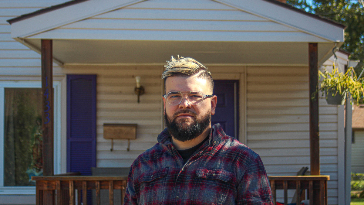 Rafael Medrano Jr. stands in front of his parents' home in the Argentine neighborhood in Kansas City, Kansas. Medrano Jr. is one of the thousands of Kansans who are registered as unaffiliated rather than with a political party. (Zachary Linhares/The Beacon)
