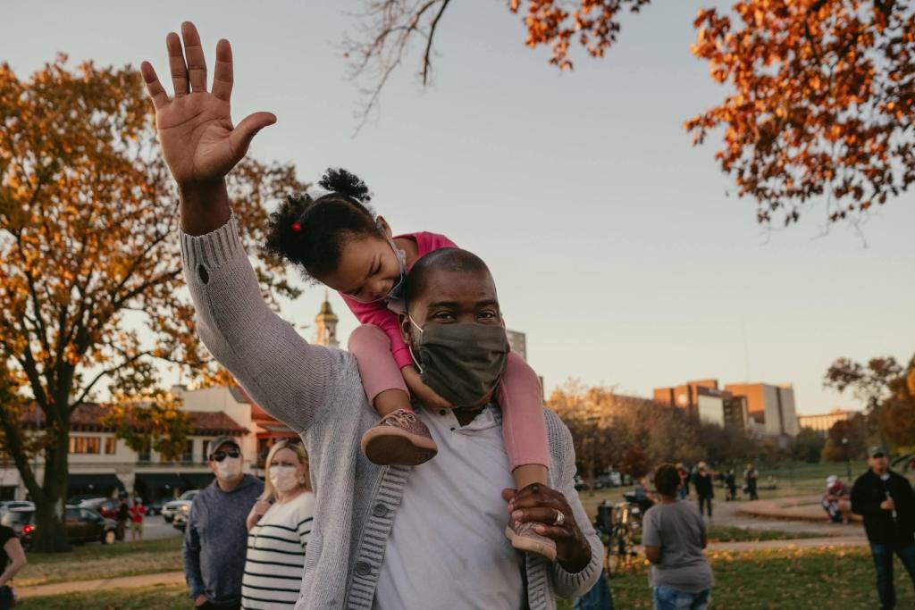 Brianna Malone looks at her dad, Malcolm Malone, as he celebrates the Biden-Harris victory at Mill Creek Park yesterday. Chase Castor/The Beacon