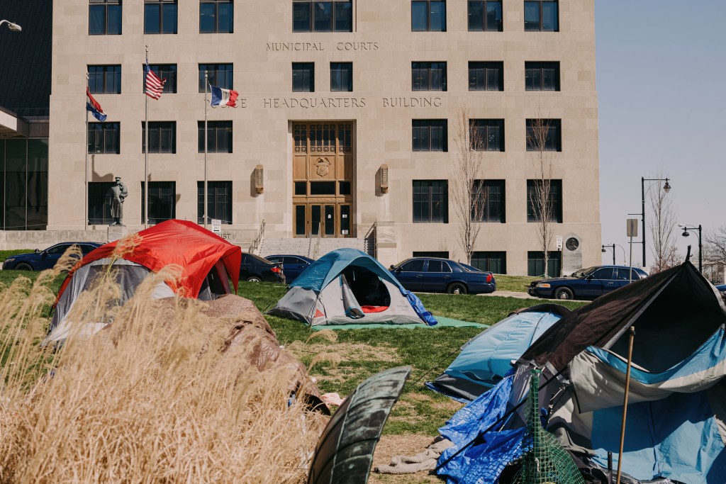 Tents are set up on the front lawn of City Hall, with the headquarters of the Kansas City Police Department nearby. The camp has been occupied by the Kansas City Homeless Union since the end of January.