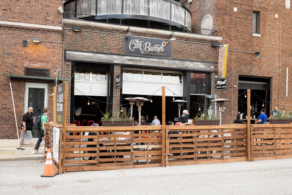 A picture of City Barrel Brewery + Kitchen's outdoor dining space on Holmes Street in downtown Kansas City.