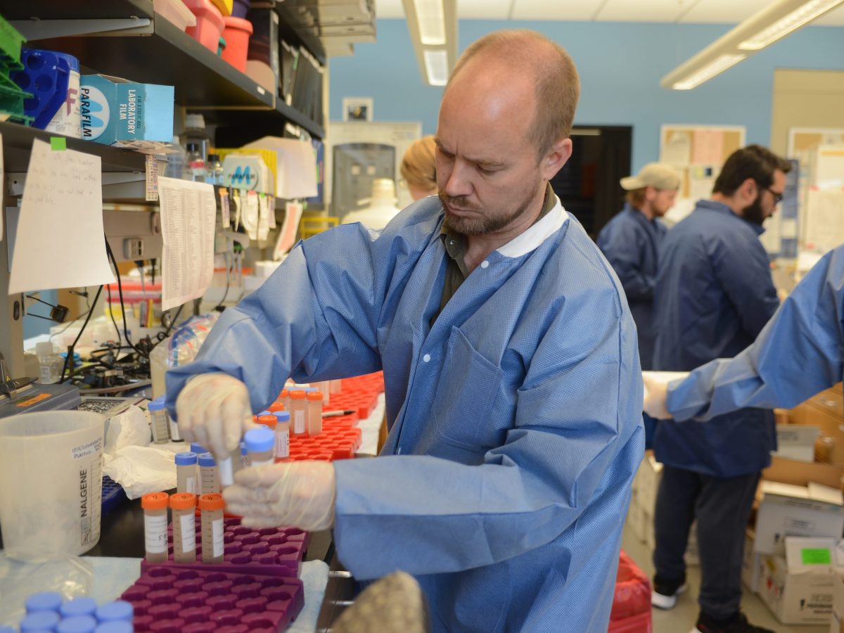 A researcher prepares waste water samples for RNA removal.