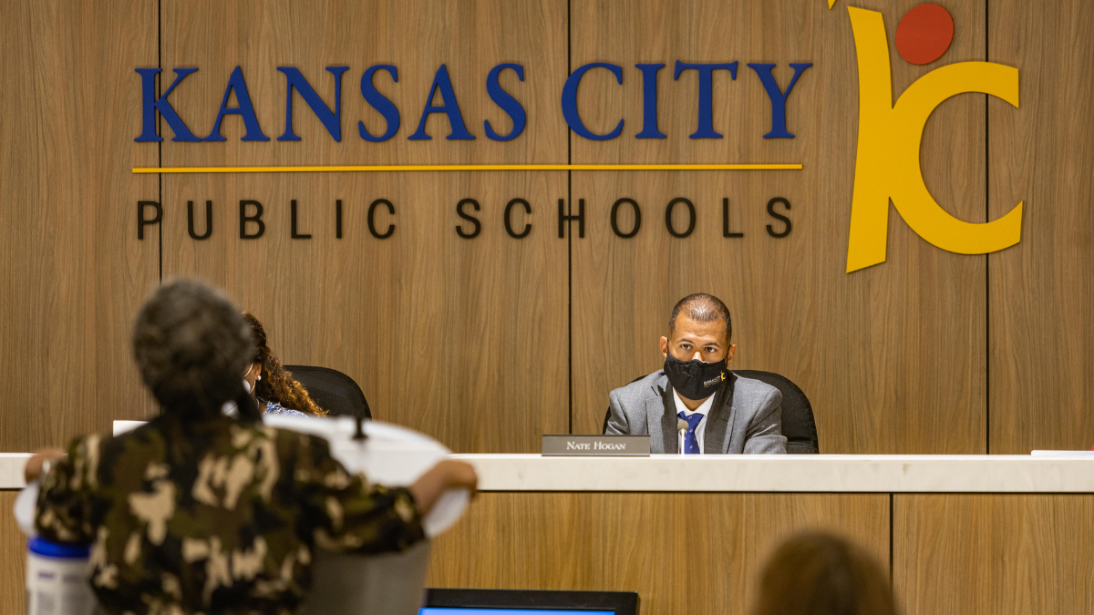 Kansas City Public Schools Board Chair Nate Hogan listens to Alicia Black-Mackey speak about her concerns with changes at Paseo Academy during the public comment period of a school board meeting July 21, 2021 in Kansas City, Missouri.
