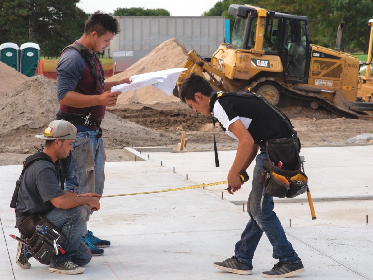 A construction crew works on the foundation for one of the first 40 houses in the Riverside Housing Redevelopment District. (Alex Unruh/The Beacon)