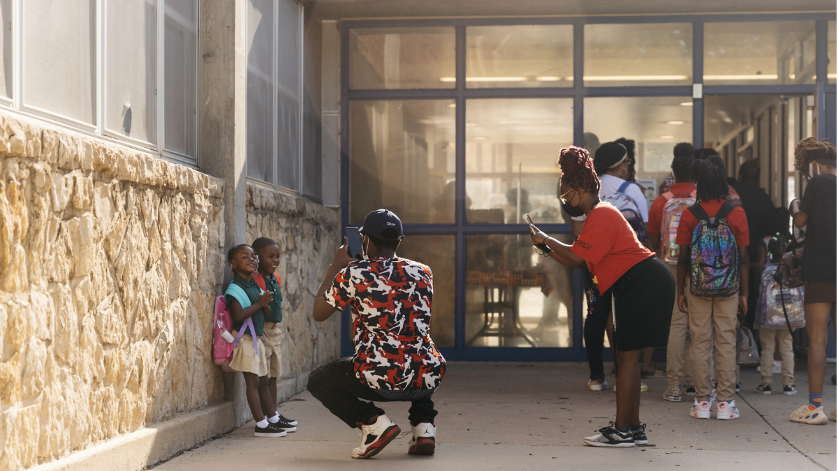 From left to right, Melanie Blount, Terrance Blount Jr., Terrance Blount Sr. and Tania Bolton, commemorated the first day of school in front of African-Centered College Preparatory Academy on Aug. 23 in Kansas City.
