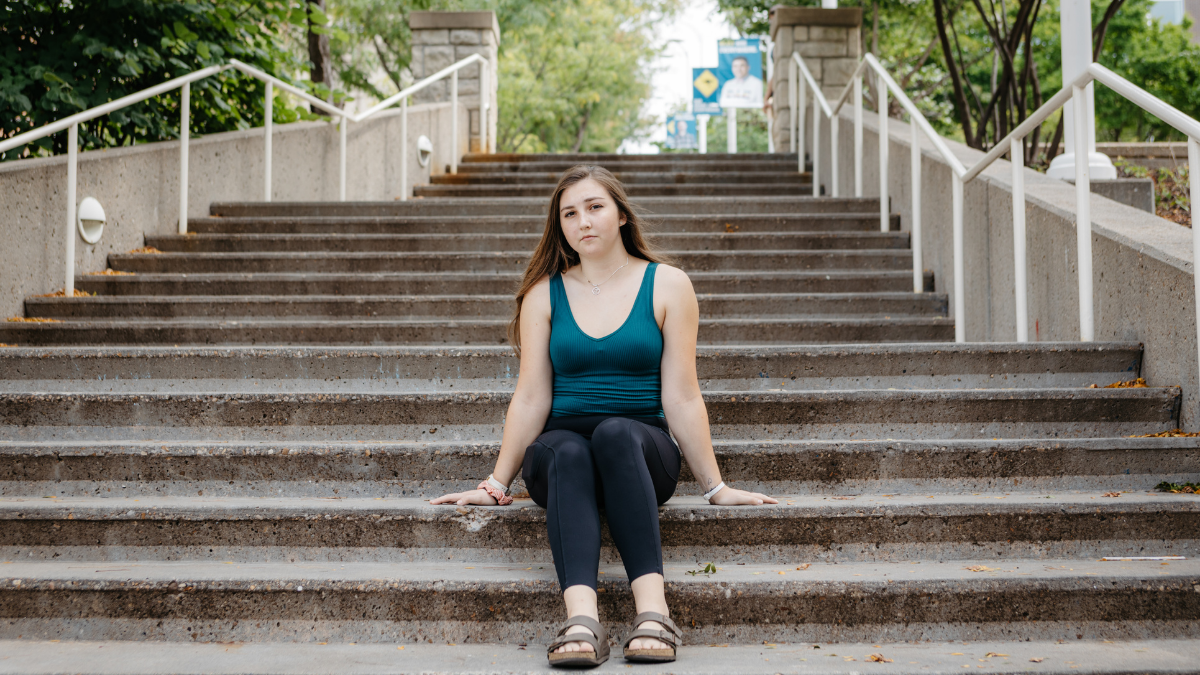 Sky Boschen is pictured on the steps leading down to Oak Street Hall on the UMKC campus Sept. 14, 2021.