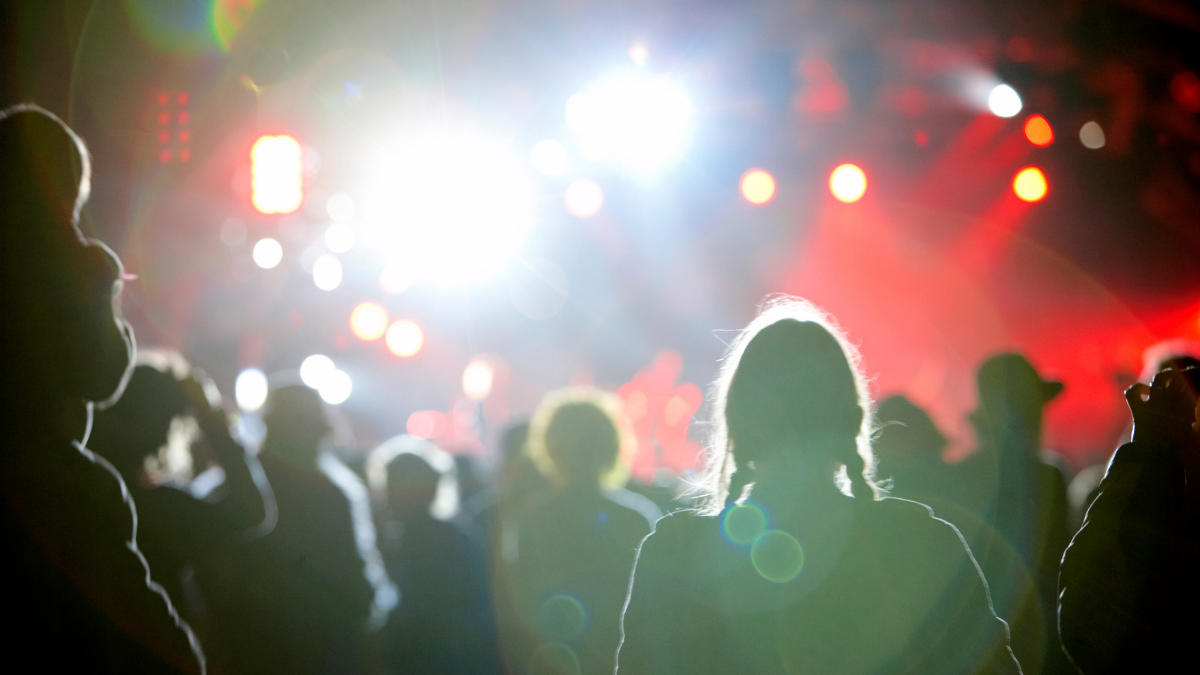 Photo of people standing on a dance floor