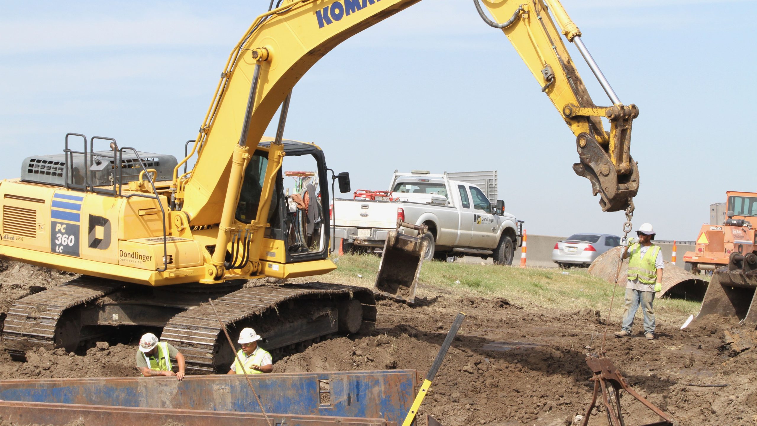 Crews work to repair a water main break near 17th Street and Interstate 35.
