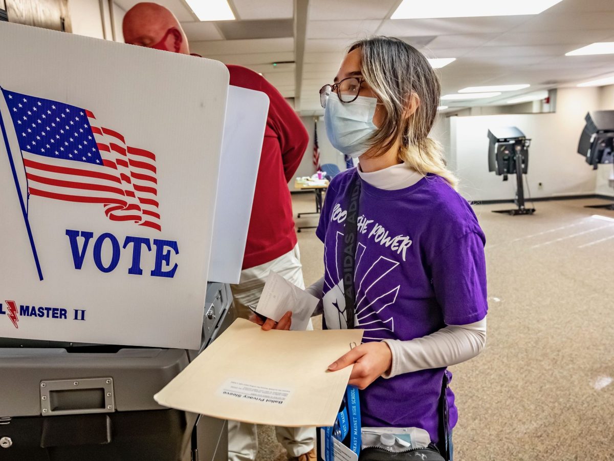 Root the Power member Dione Ramos voted for the first time Tuesday at the Historic County Courthouse in downtown Wichita.