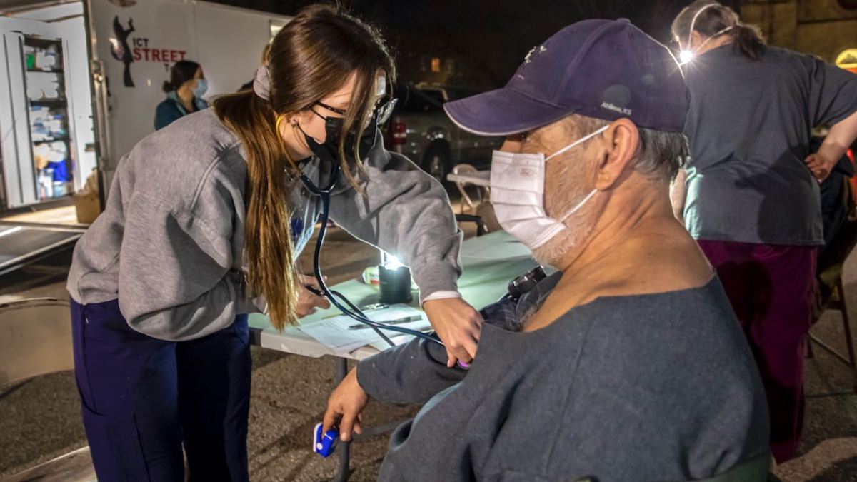 Certified nursing assistant Danyel Yardley volunteers with ICT Street Team