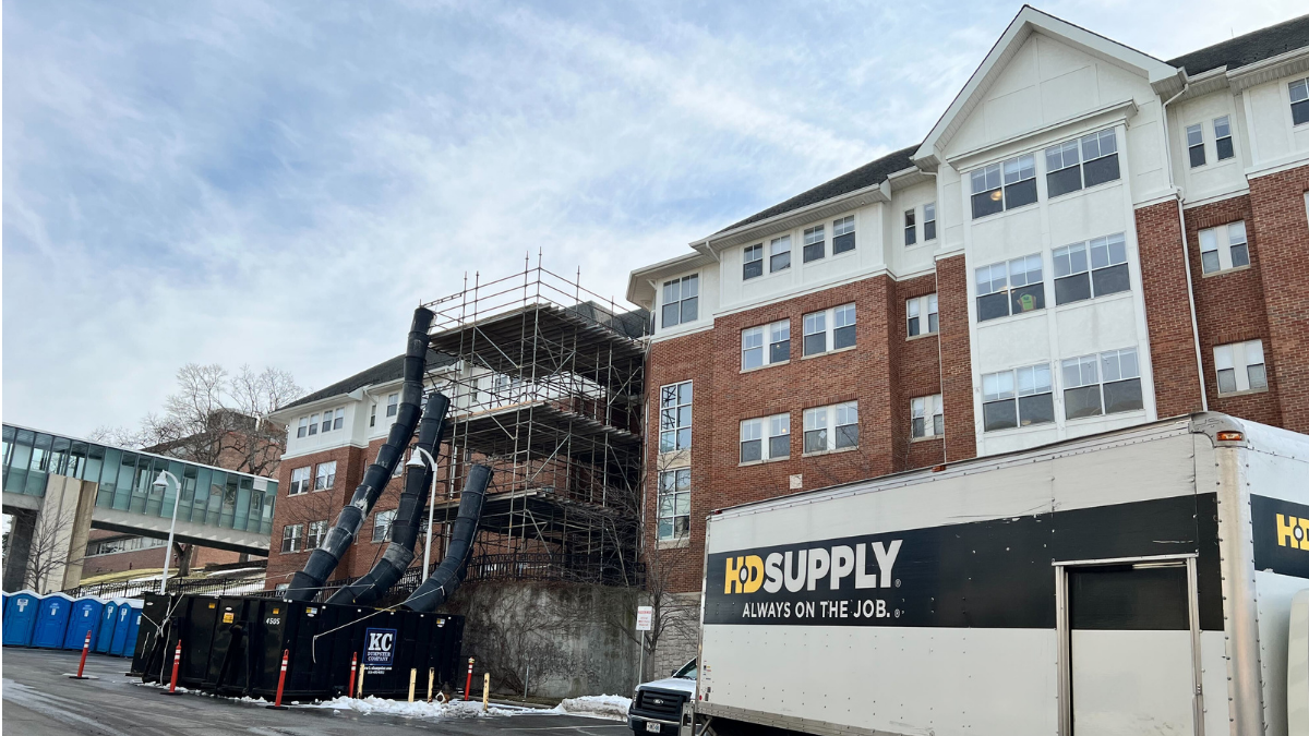Workers set up scaffolding and chutes to remove damaged dry wall from Oak Street Hall, pictured Jan. 18 on the University of Missouri-Kansas City Volker Campus. A Jan. 3 flood caused by frozen pipes displaced about 150 students from 117 rooms.