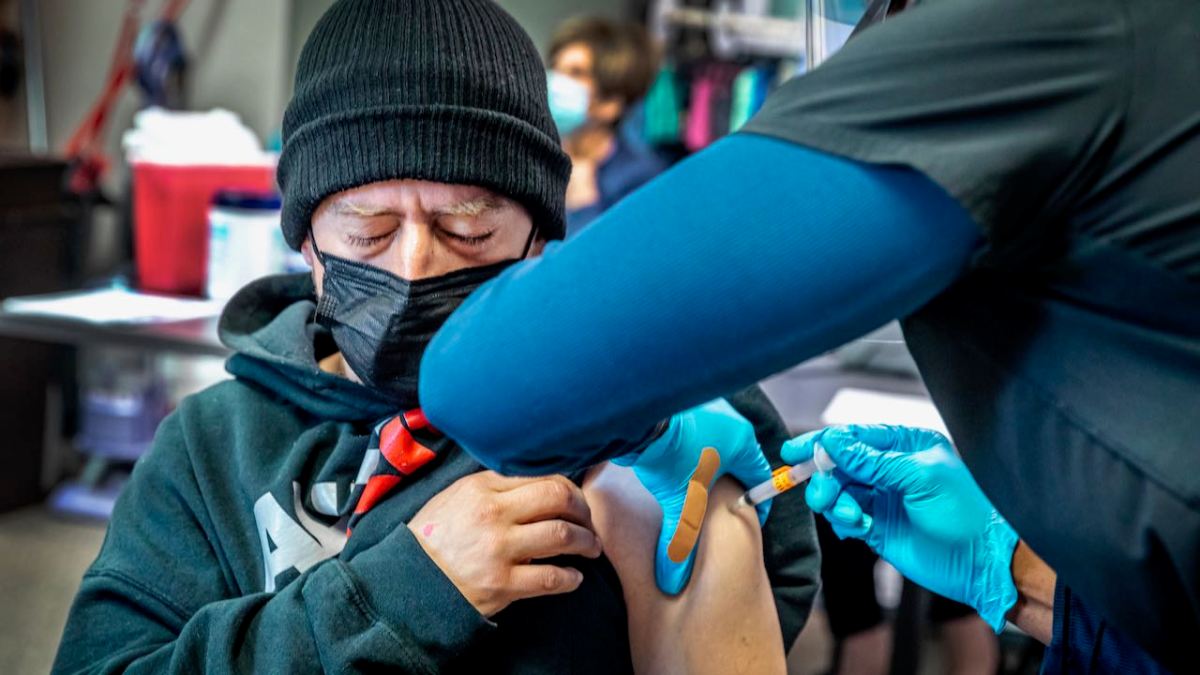 Robert York receives a COVID-19 vaccination.