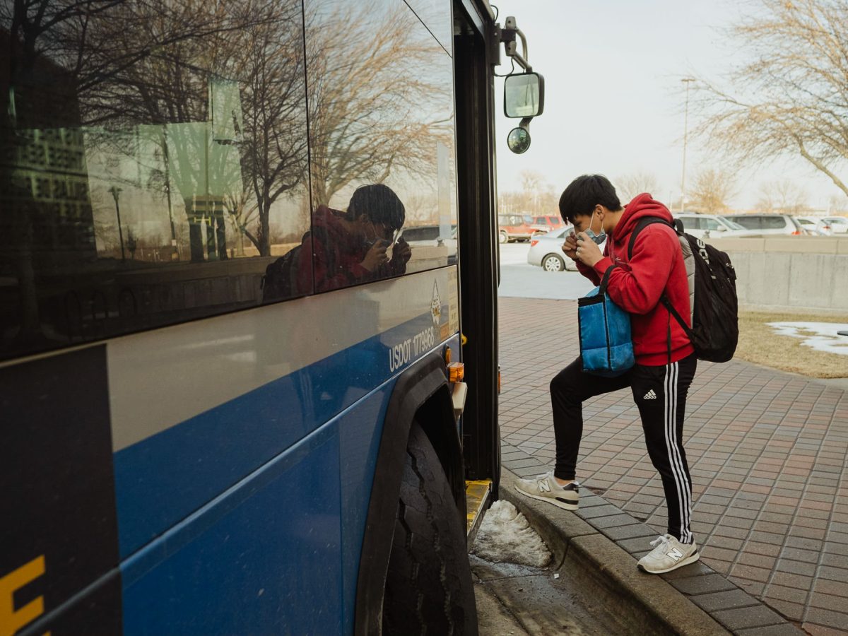A Johnson County Community College student leaves campus by bus Feb. 28 in Overland Park.