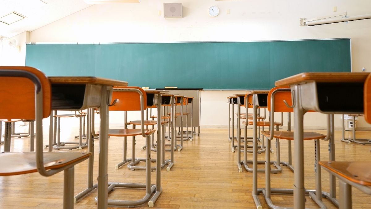 Desks in an empty school classroom