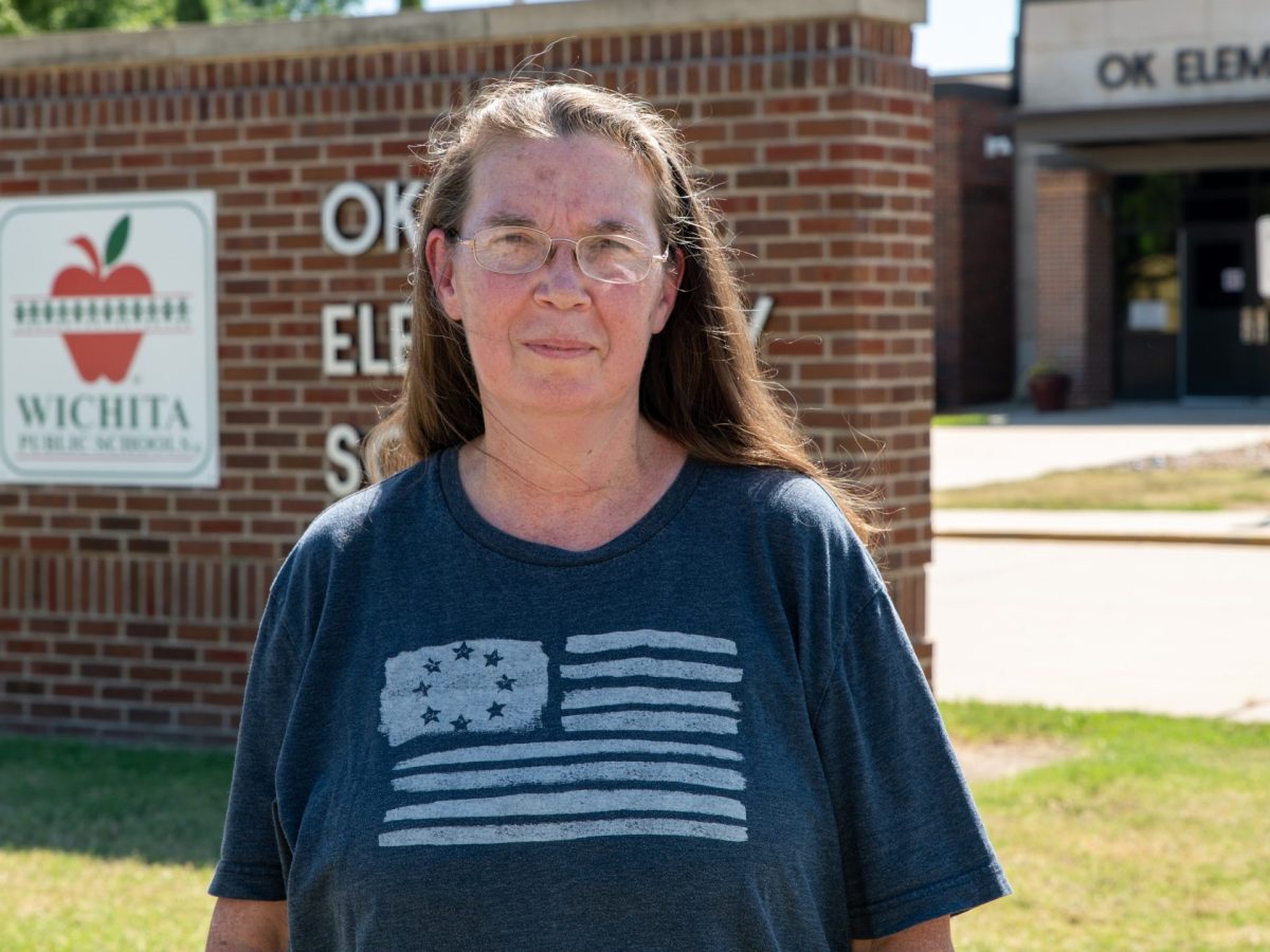 Lisa Chrans standing in front of OK Elementary School.