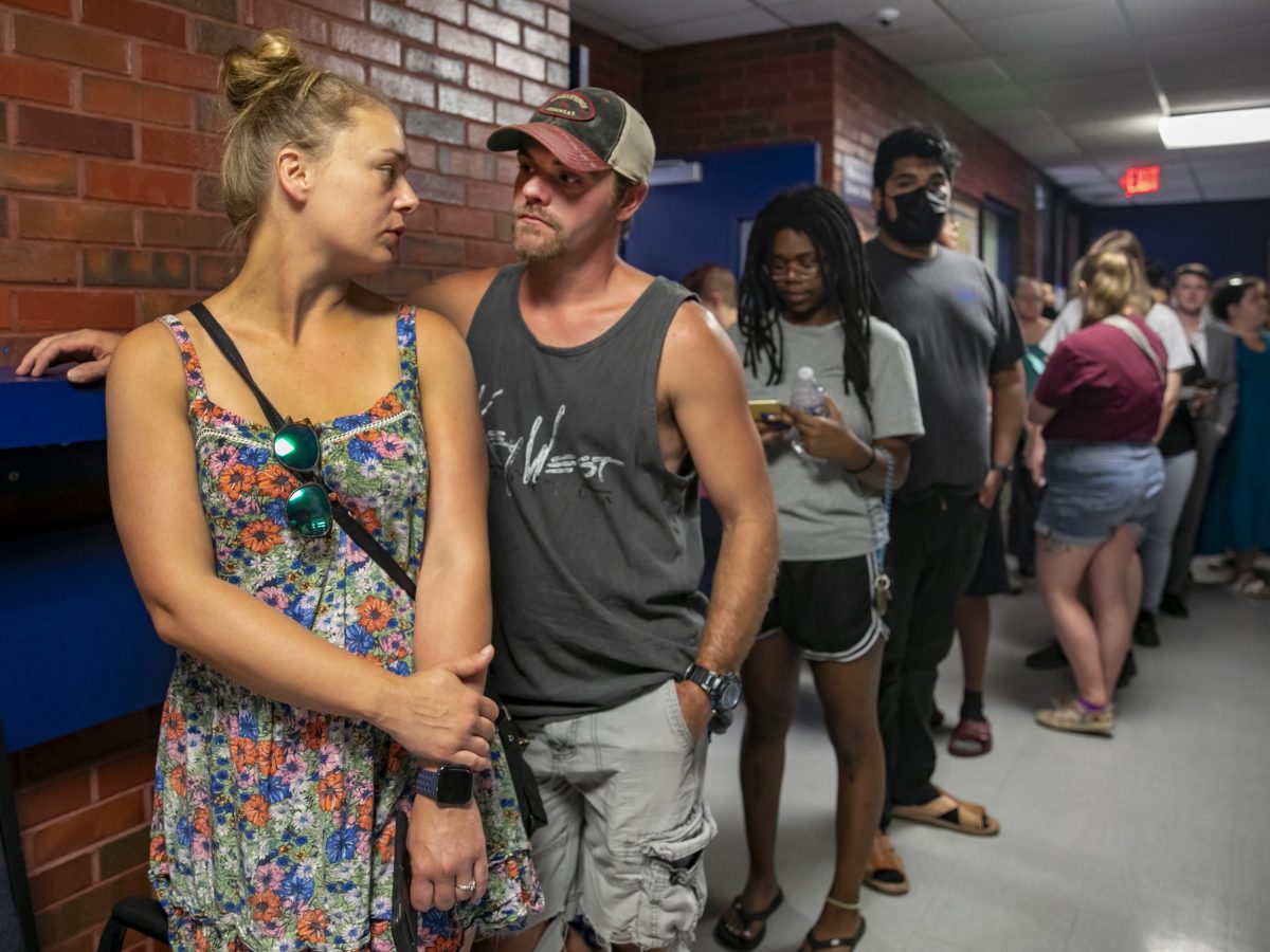 Voters waited up to three hours to cast ballots in the August 2022 primary. Sedgwick County cut funding for mass mailing of applications for mail-in ballots. Advocates say mail-in ballots reduce wait times.