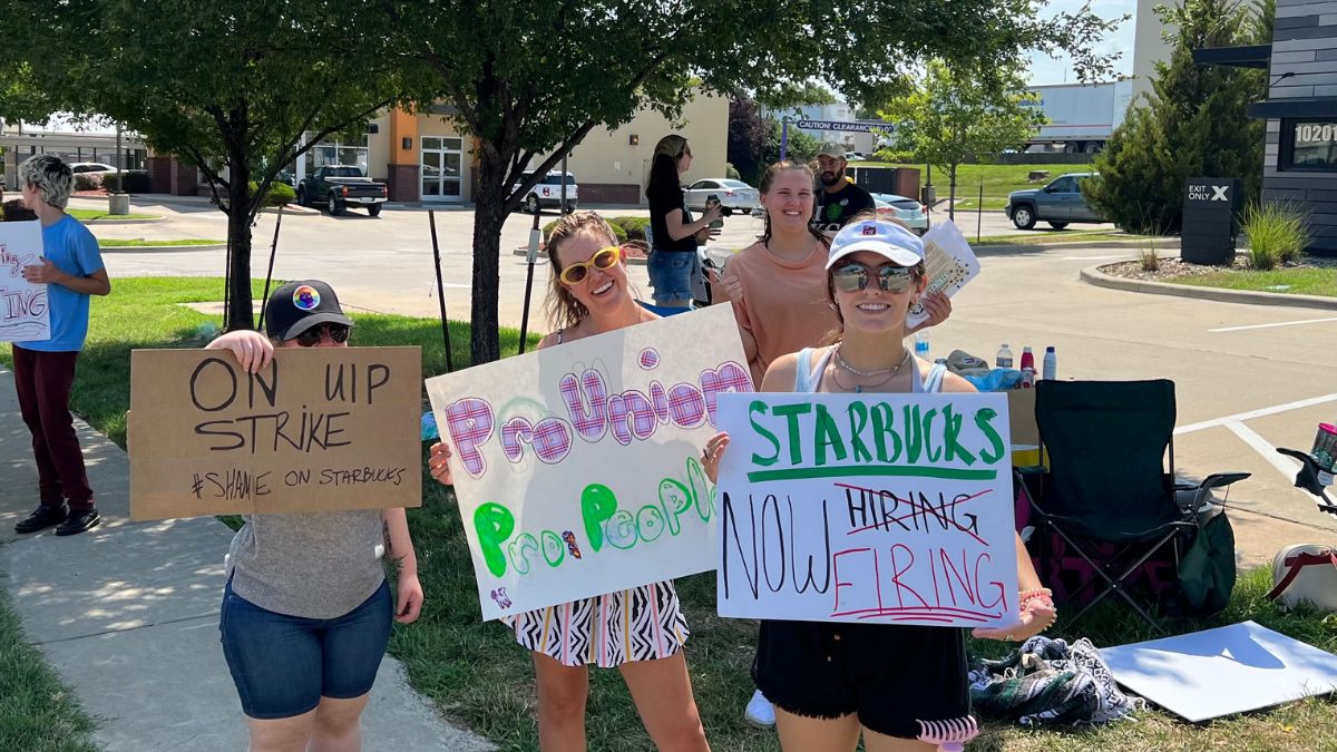 Protestors holding signs