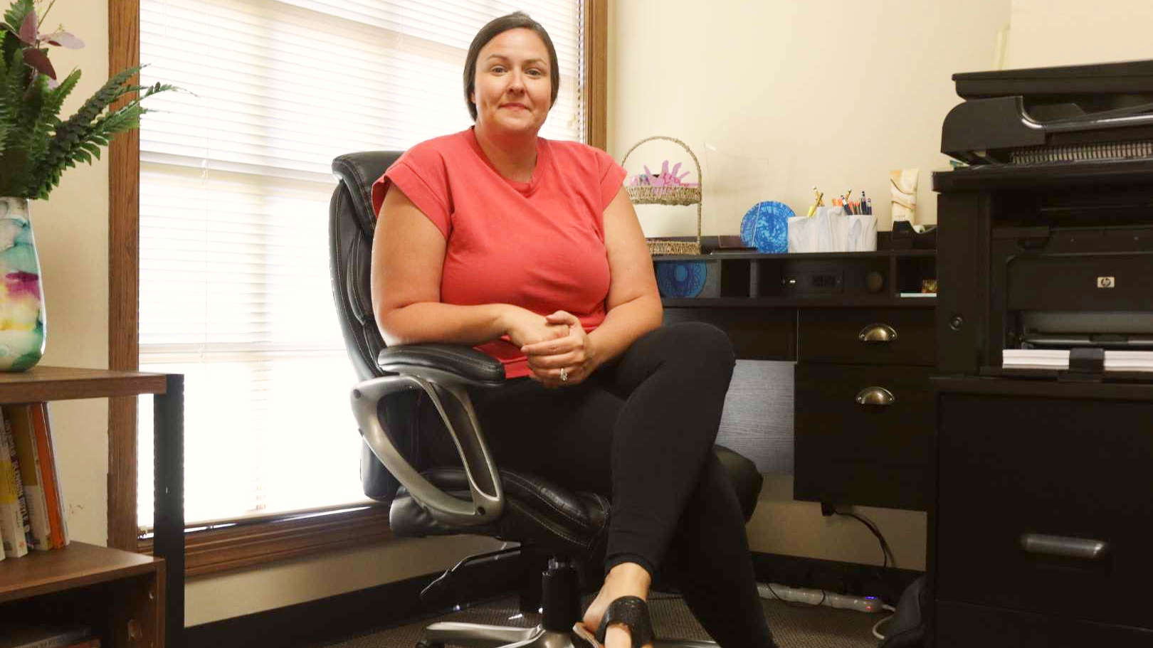 Nicole Fenoglio sitting in her office.