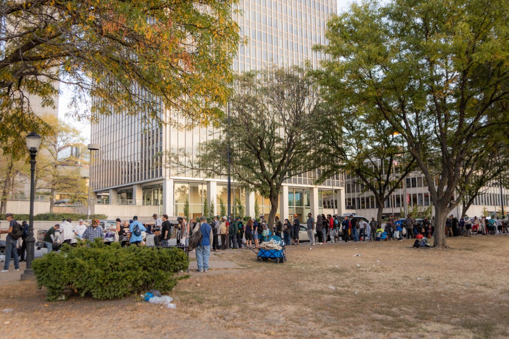 People line up for the Feeding and Fellowship dinner.