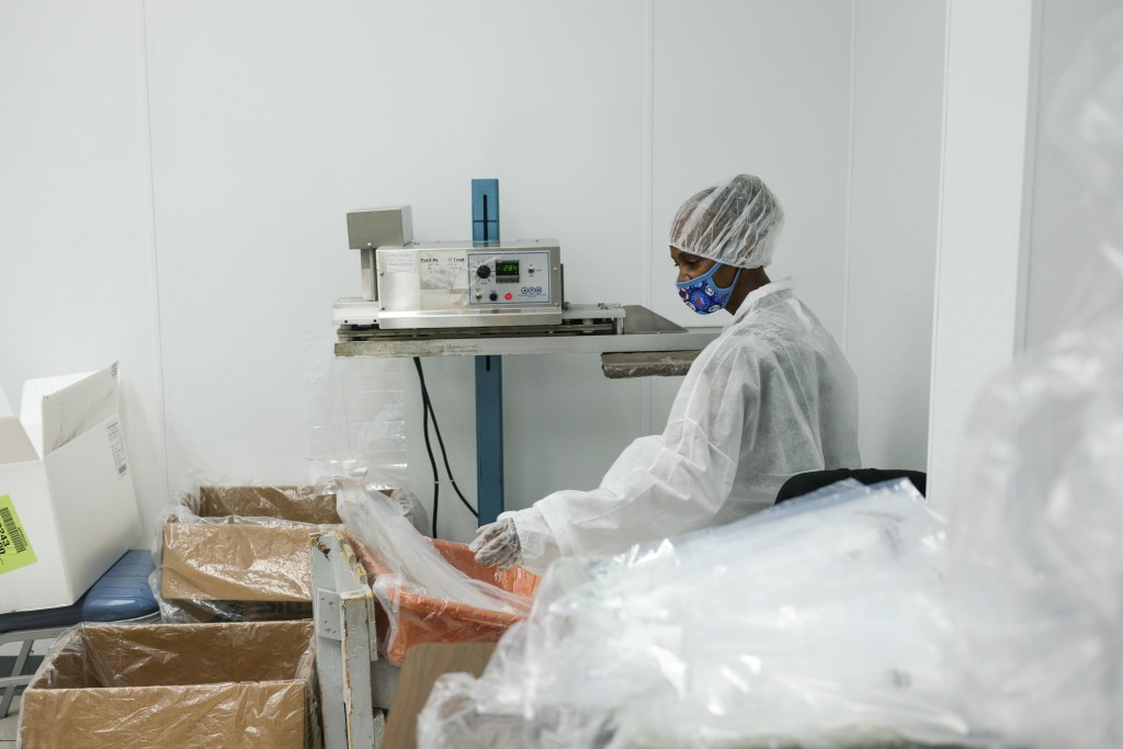 A sheltered workshop worker seals neo-natal care kits in the Òpharma roomÓ at Project CU sheltered workshop in St. Louis, Missouri.