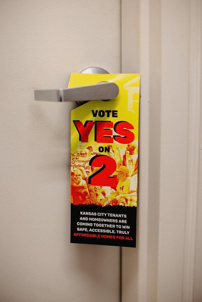 A door hanger that says in large text, "Vote yes on 2." There is smaller text underneath that says, "Kansas City tenants and homeowners are coming together to win safe, accessible, truly affordable homes for all."