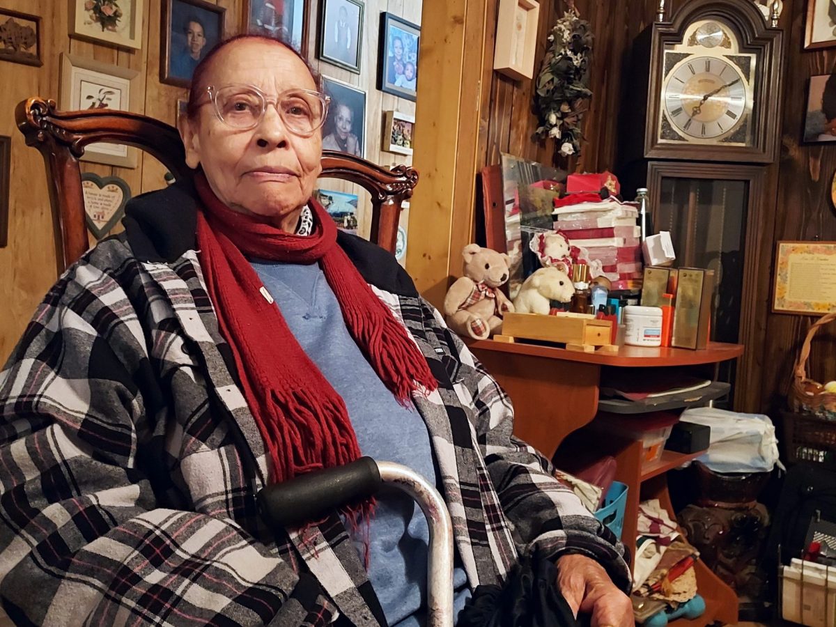 Ruby Ligon did not know of the toxic chemical in Wichita contaminating groundwater in her neighborhood. She is surrounded by photos of the family she raised in her home.