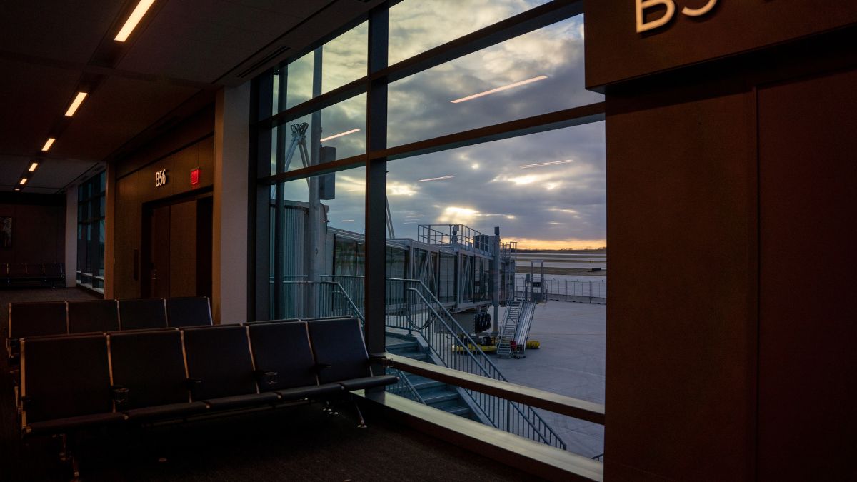 A view out the window of the new KCI terminal, showing a glass boarding bridge.