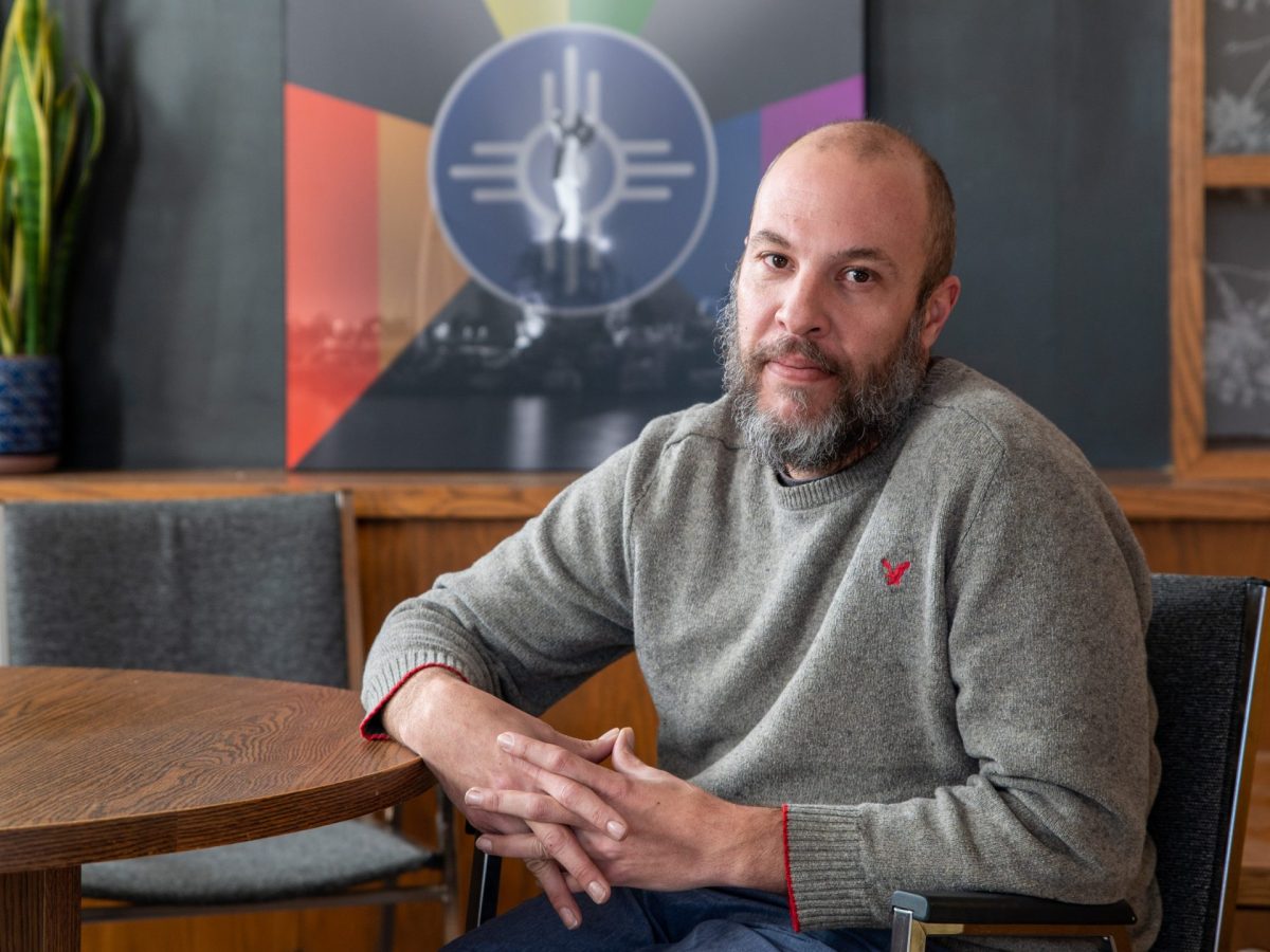 Mike Harris sitting at a table.