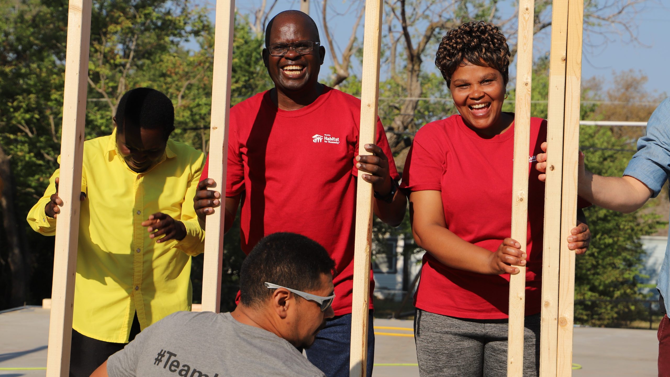 Gédéon Jino, a refugee from the Congo, at the wall-raising ceremony with wife Francine.