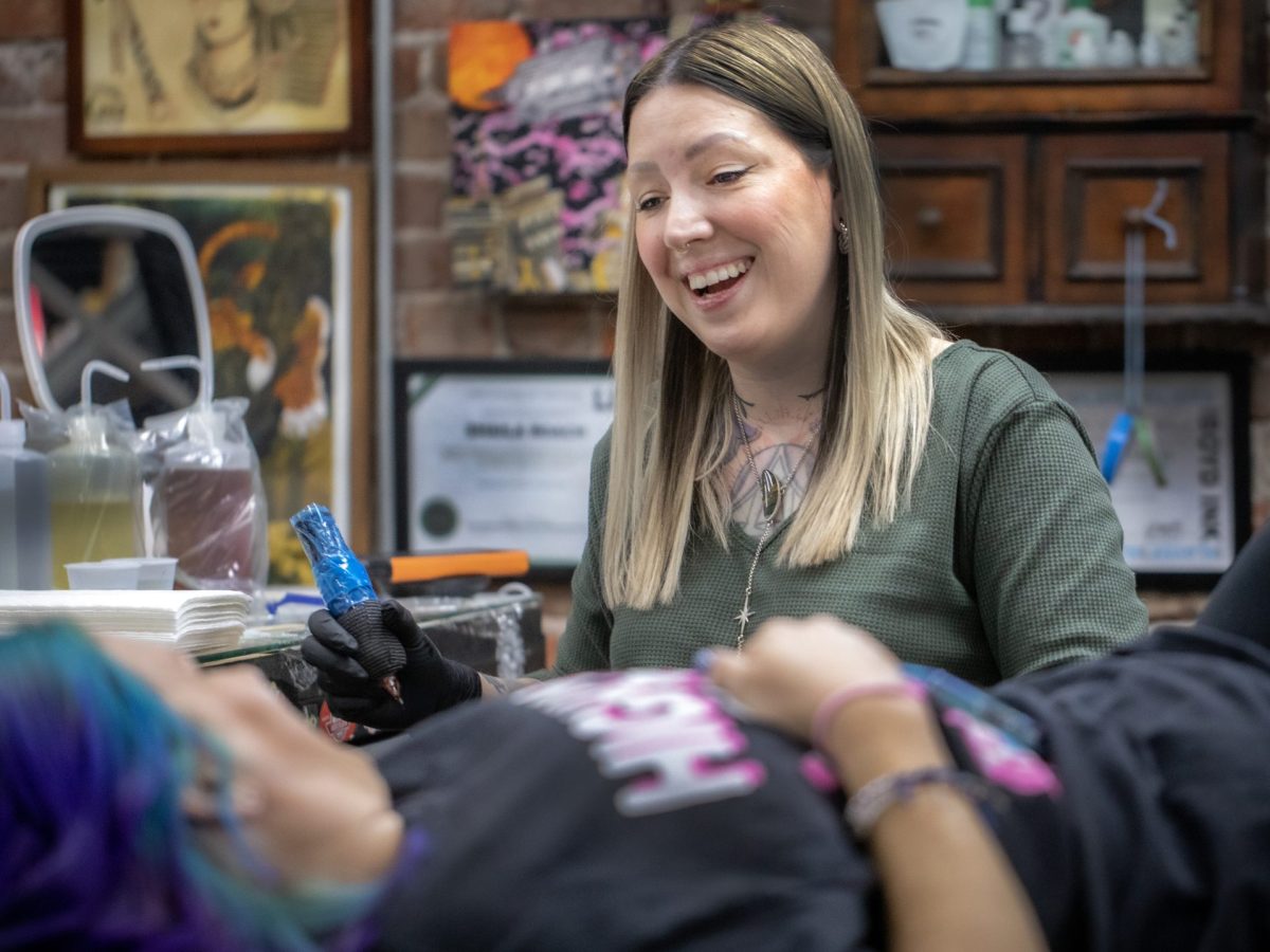 Wichita Tattoo artist Shaila Roach works on a client.