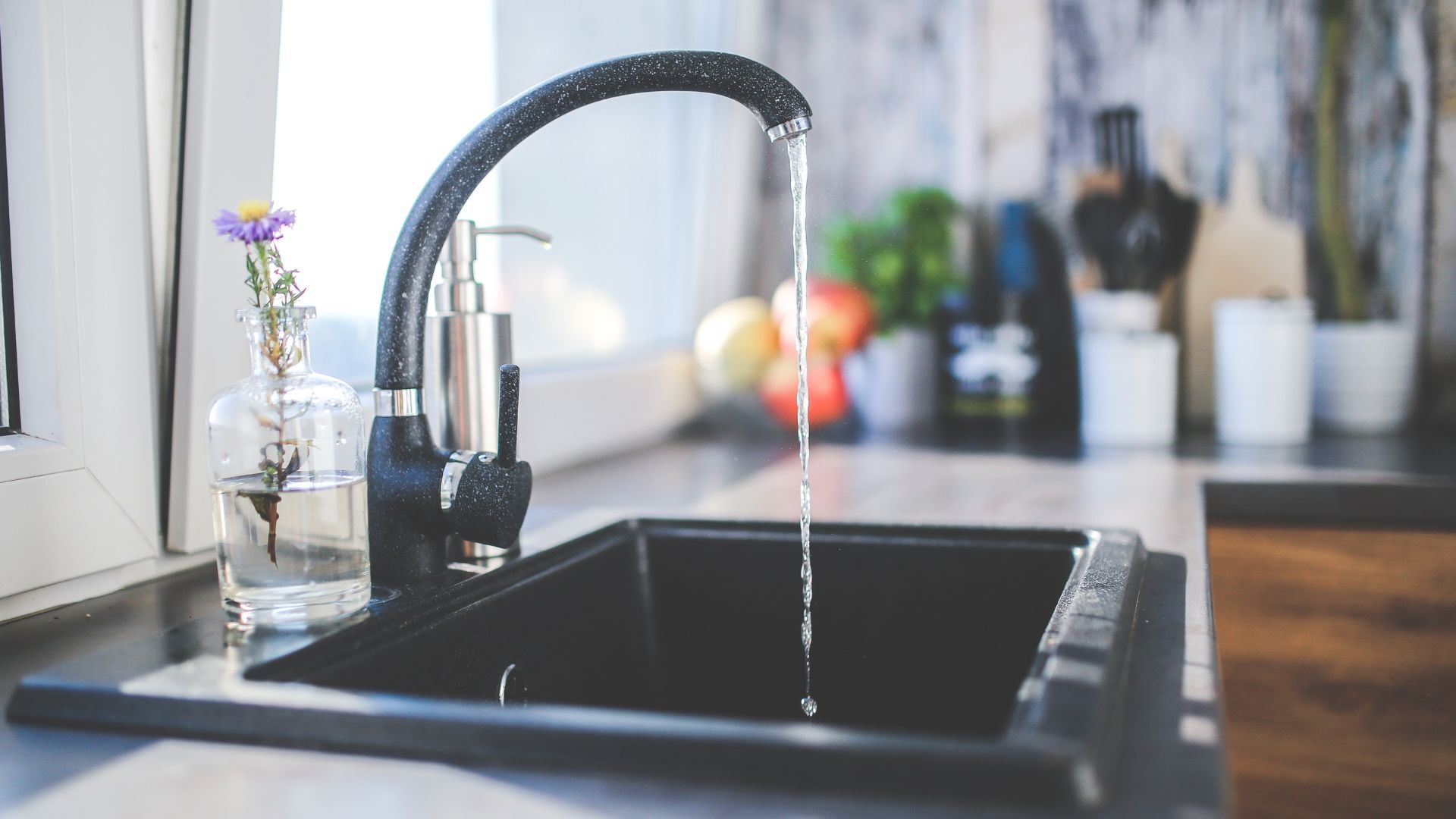 Water coming out of a kitchen sink.