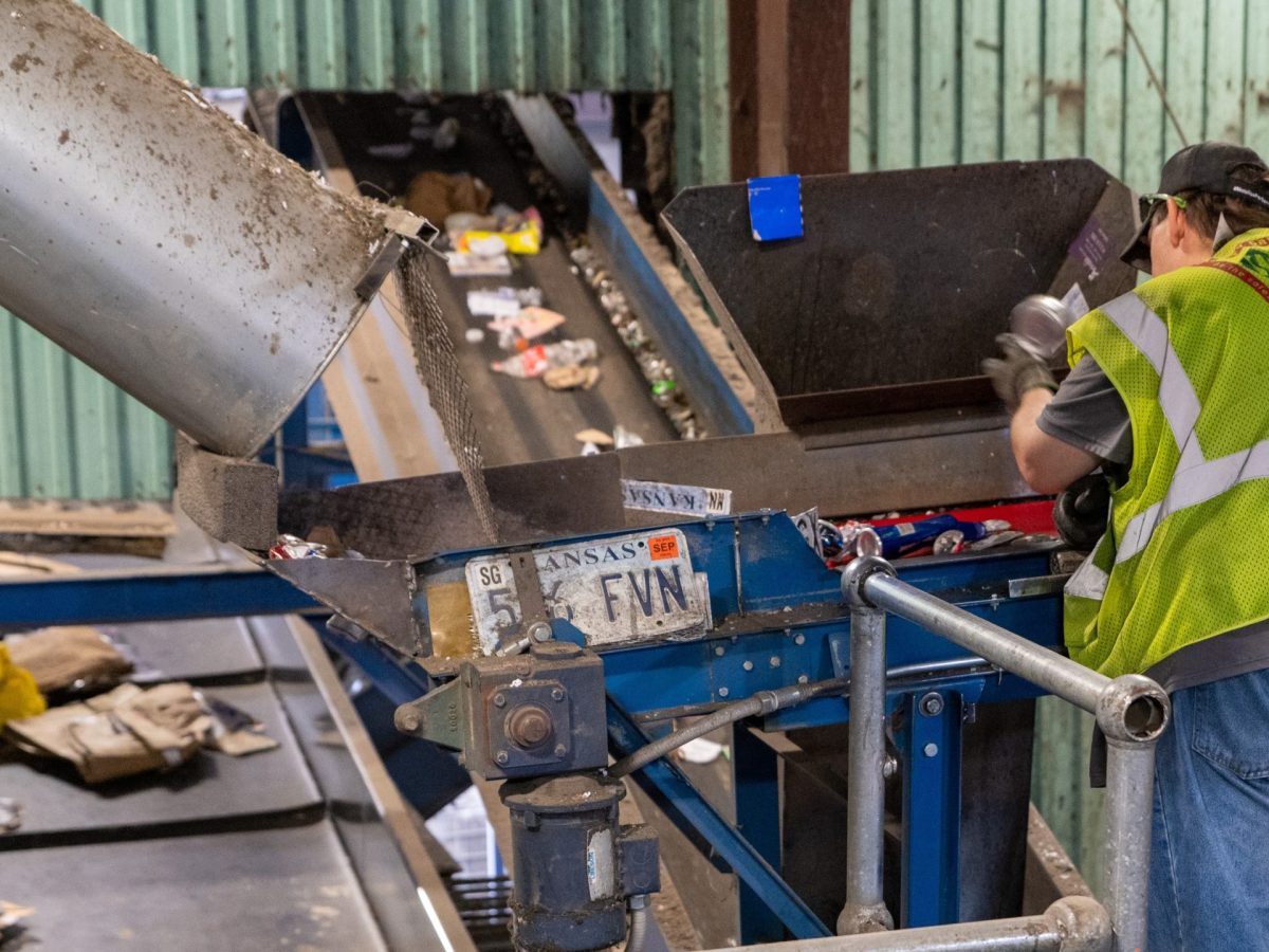 A worker at the Stutzman recycling plant in Hutchinson pulls items from the top-level sorter. Wichita recyclables picked up curbside in end up at this plant.