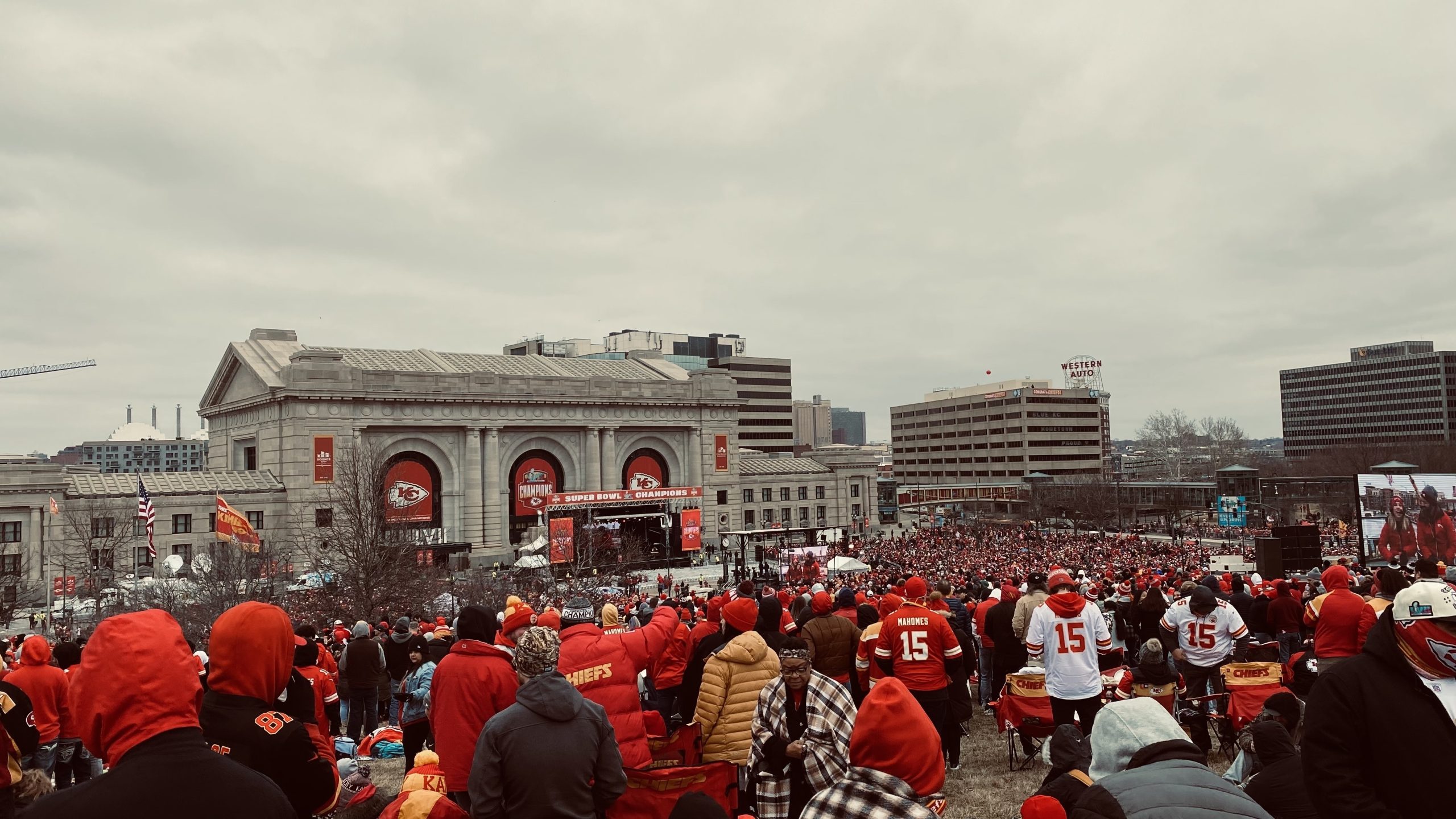 Kansas City Chiefs fans surround Union Station to welcome home Super Bowl winners.
