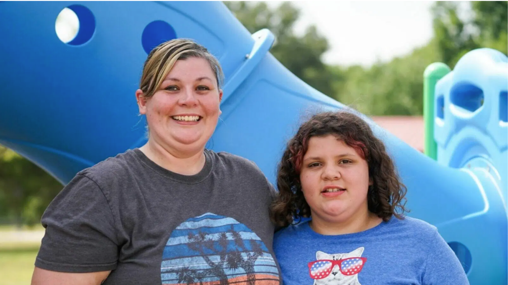 Becky Divine and her daughter, Evie, pose for a photo on Tuesday, June 27, at Indian Hills Park in Columbia, Missouri.