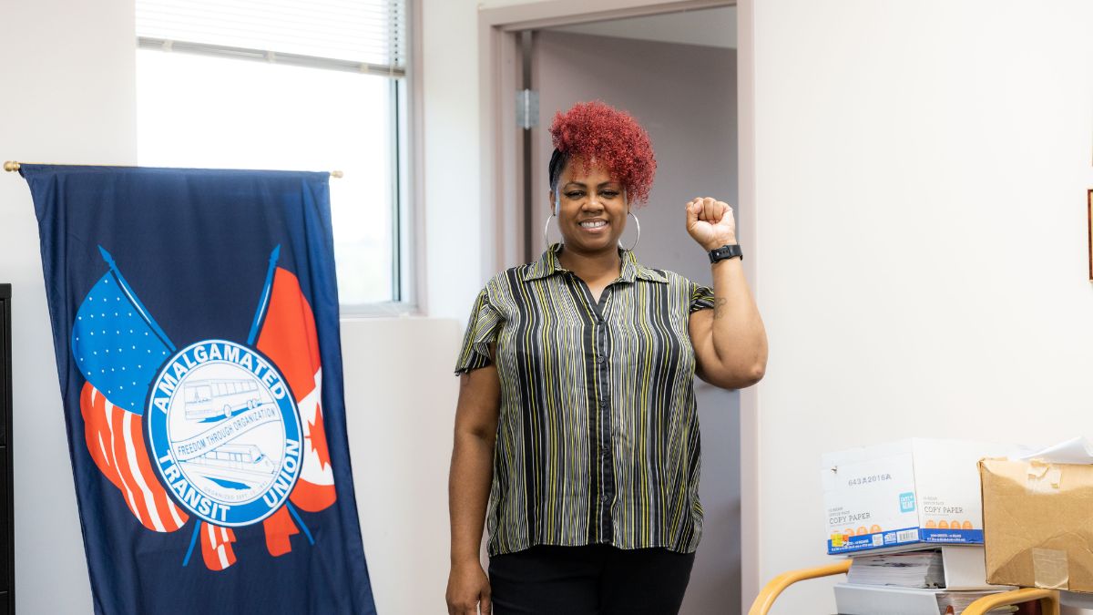 Sherrita Jackson with a fist in the air for a story about bus driver safety.