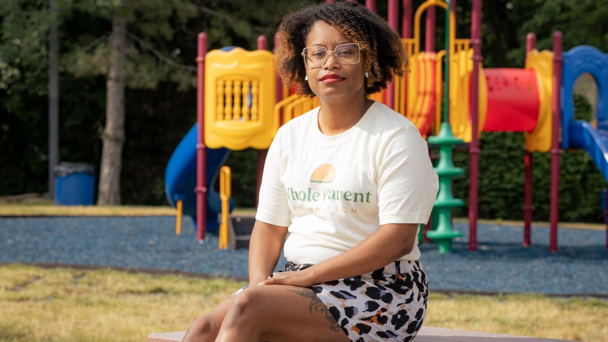 Geornesha Clayton, a Missouri mom and social worker, sits in a playground near her home in Kansas City. She was one of thousands of Missourians struggling with maternal mental health conditions. (Zach Bauman/The Beacon)