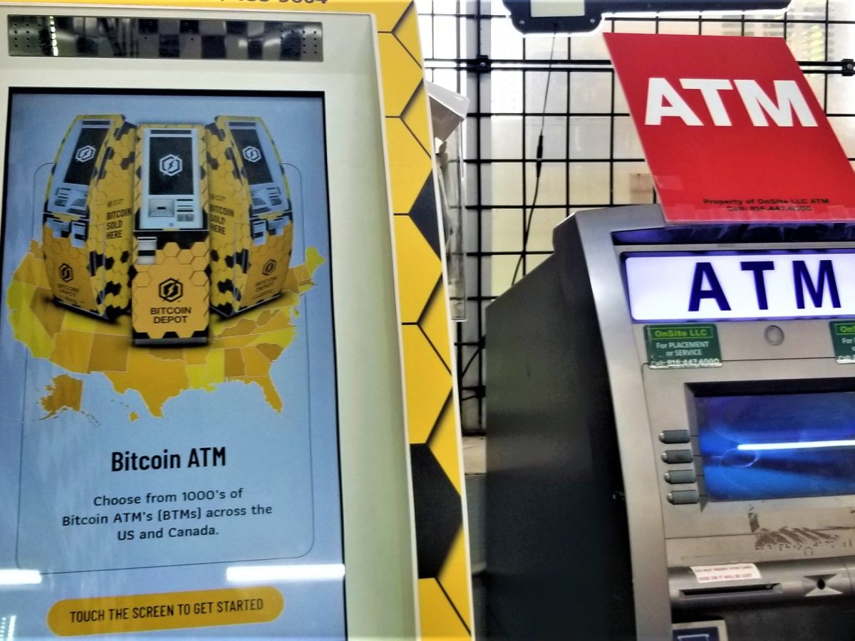 A Bitcoin ATM next to a standard ATM in a Kansas City store