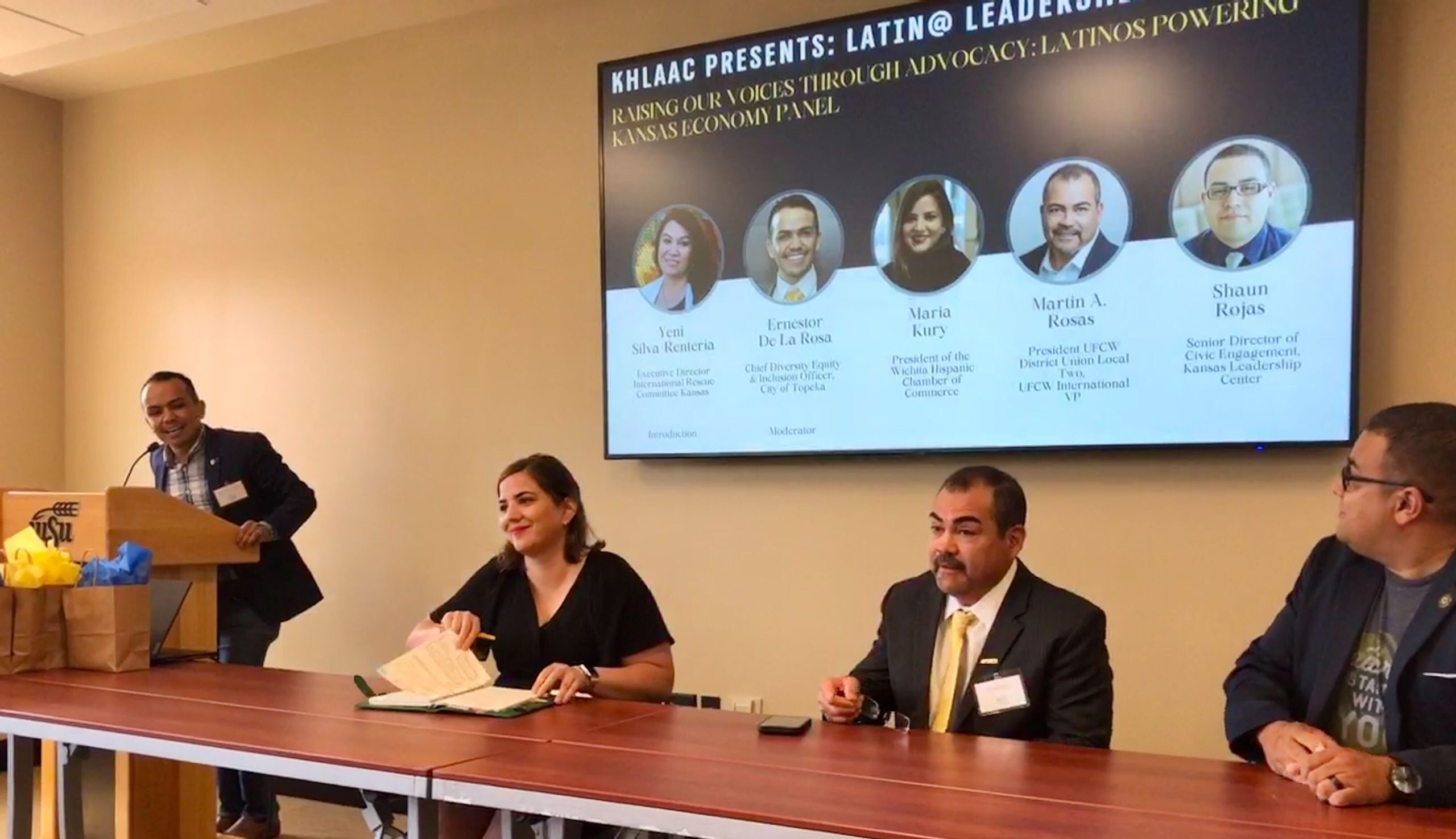 Ernestor De La Rosa, a Topeka city official, moderates a panel held July 29 at Wichita State University, “Latinos Powering the Kansas Economy.” Panelists (l-r) are Maria Kury, president of the Wichita Hispanic Chamber of Commerce; Martin A. Rosas, United Food and Commercial Workers union Local 2 president; and Shaun Rojas, senior director of civic engagement at the Kansas Leadership Center.