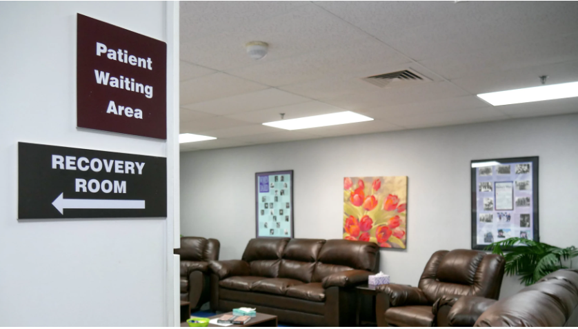 Empty couches in a clinic's waiting room.