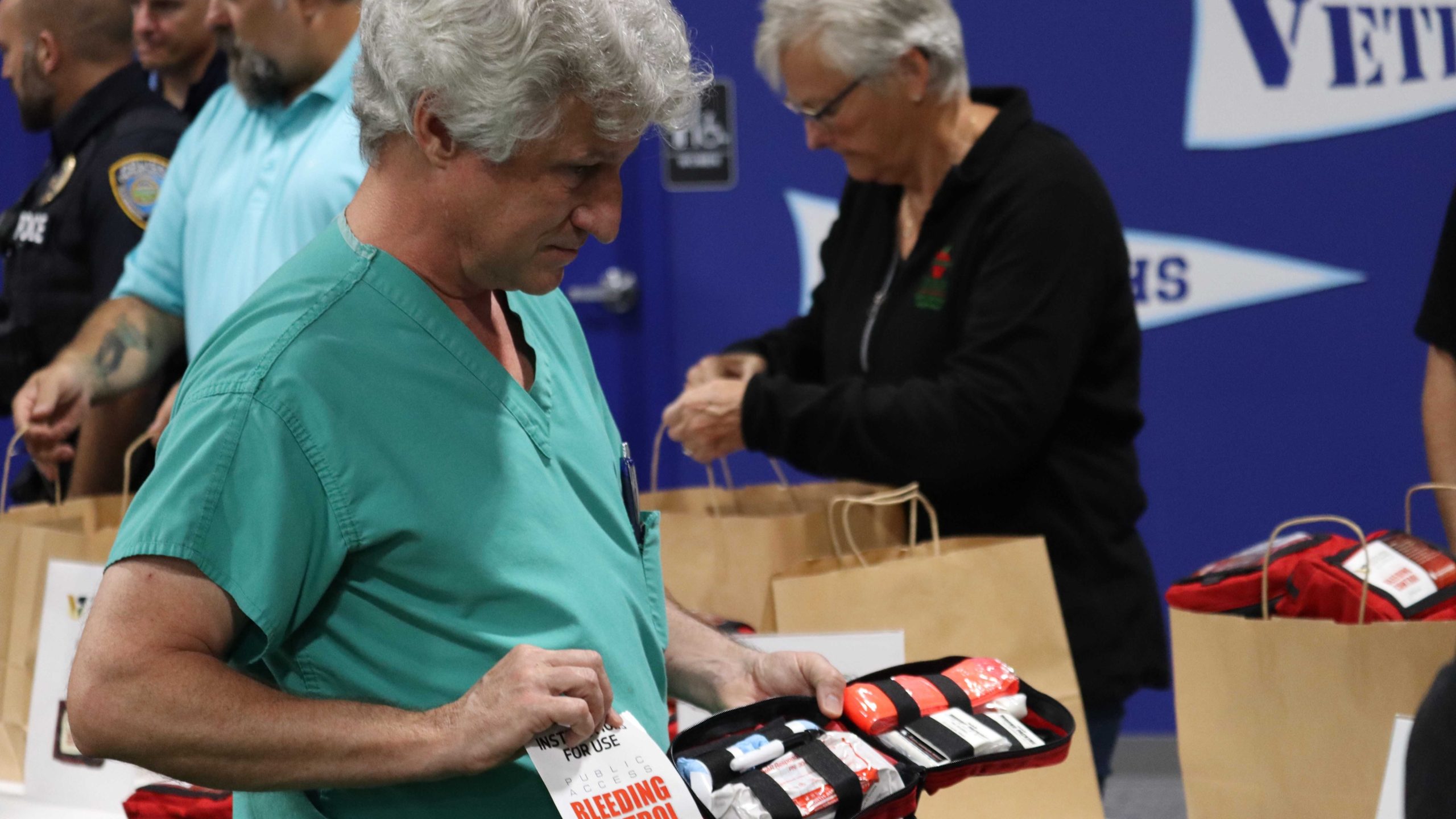 James Haan with an open first aid kit, showing its contents.