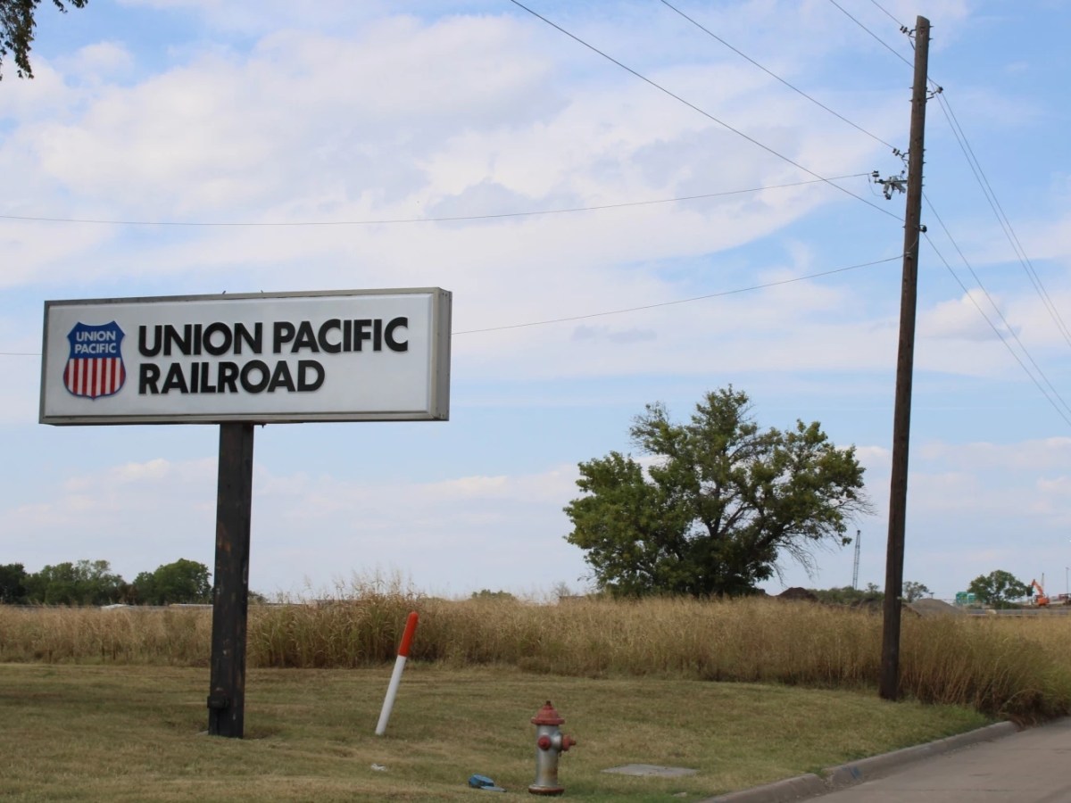 A sign next to a road that says Union Pacific Railroad.