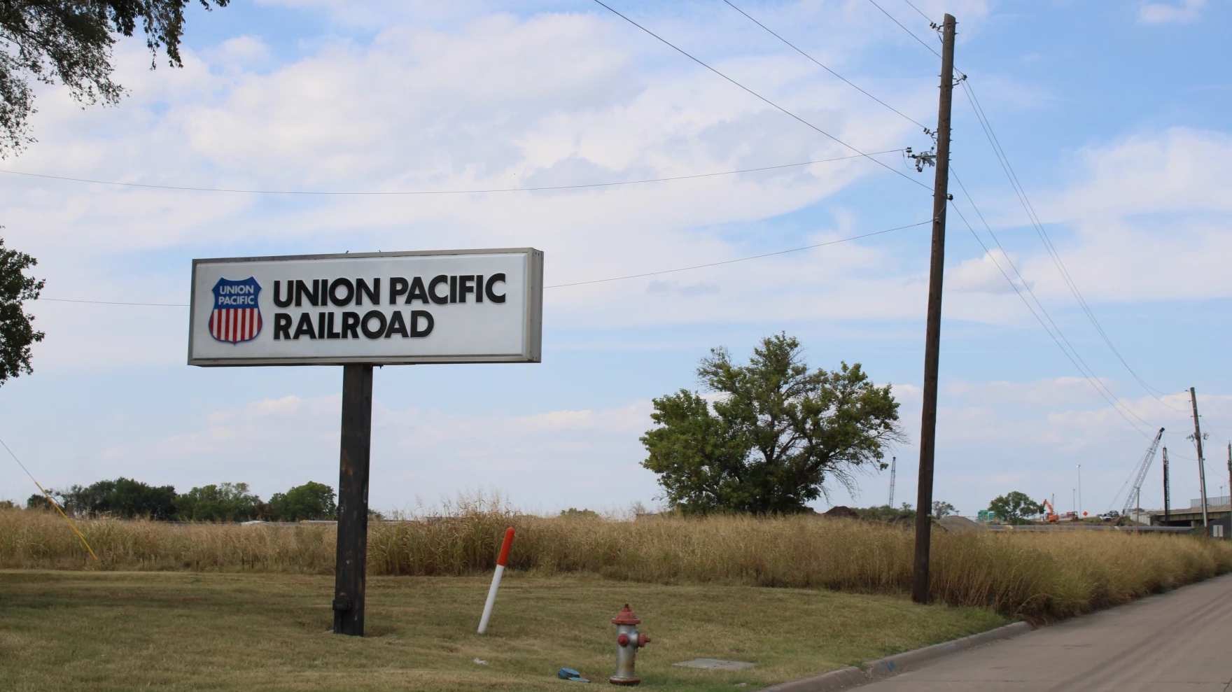 A sign next to a road that says Union Pacific Railroad.