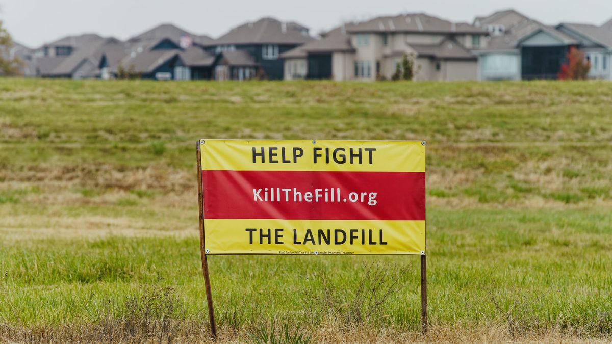 A sign opposing the landfill is pictured on the edge of Creekmore Subdivision in Raymore.