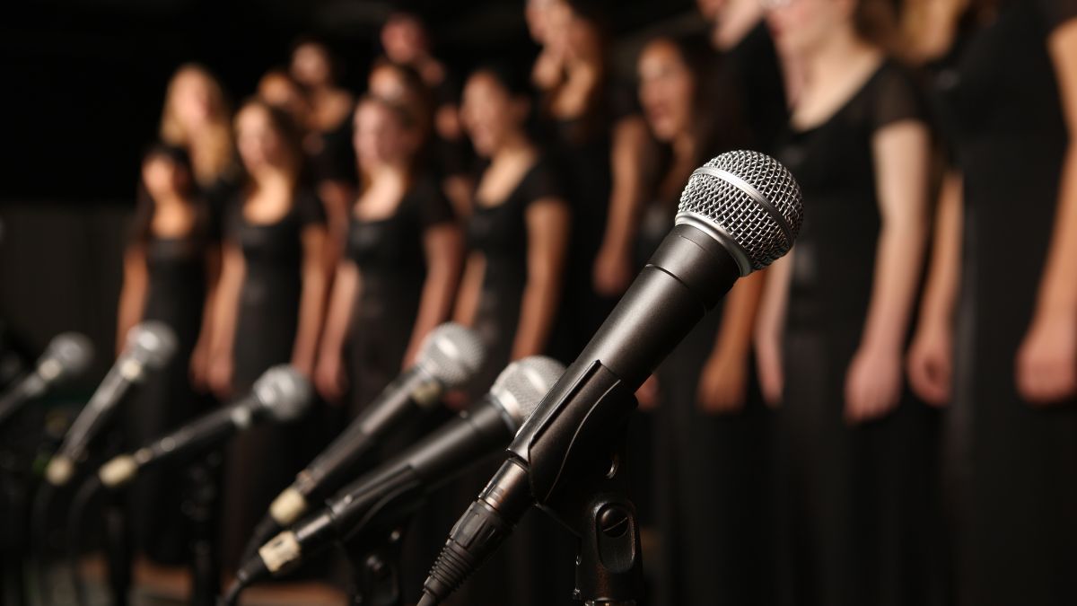 microphones in front of a choir