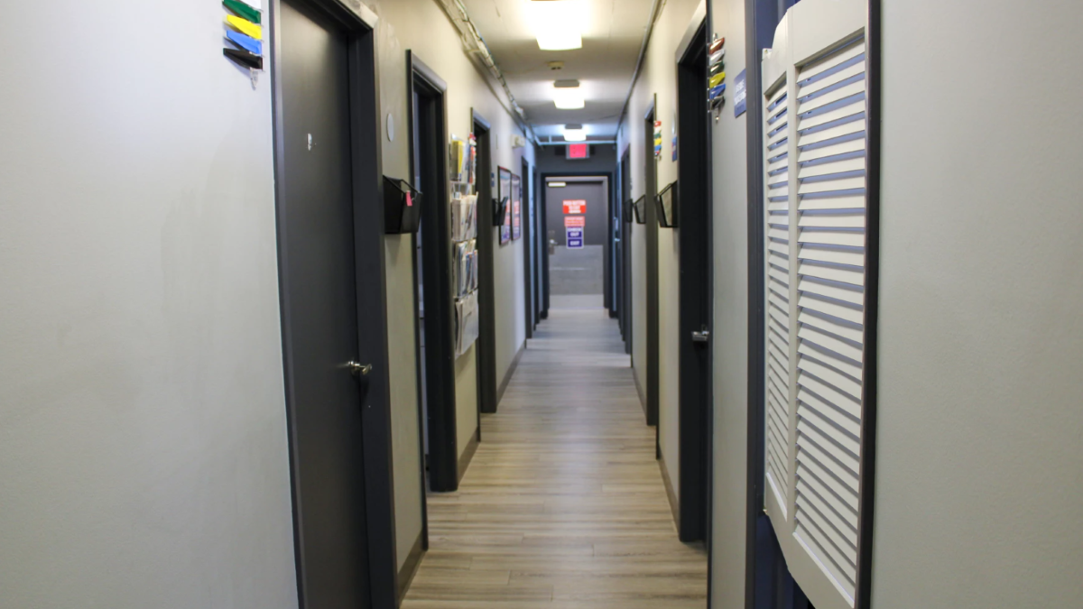 a hall way with doors on either side. abortion provider challenge