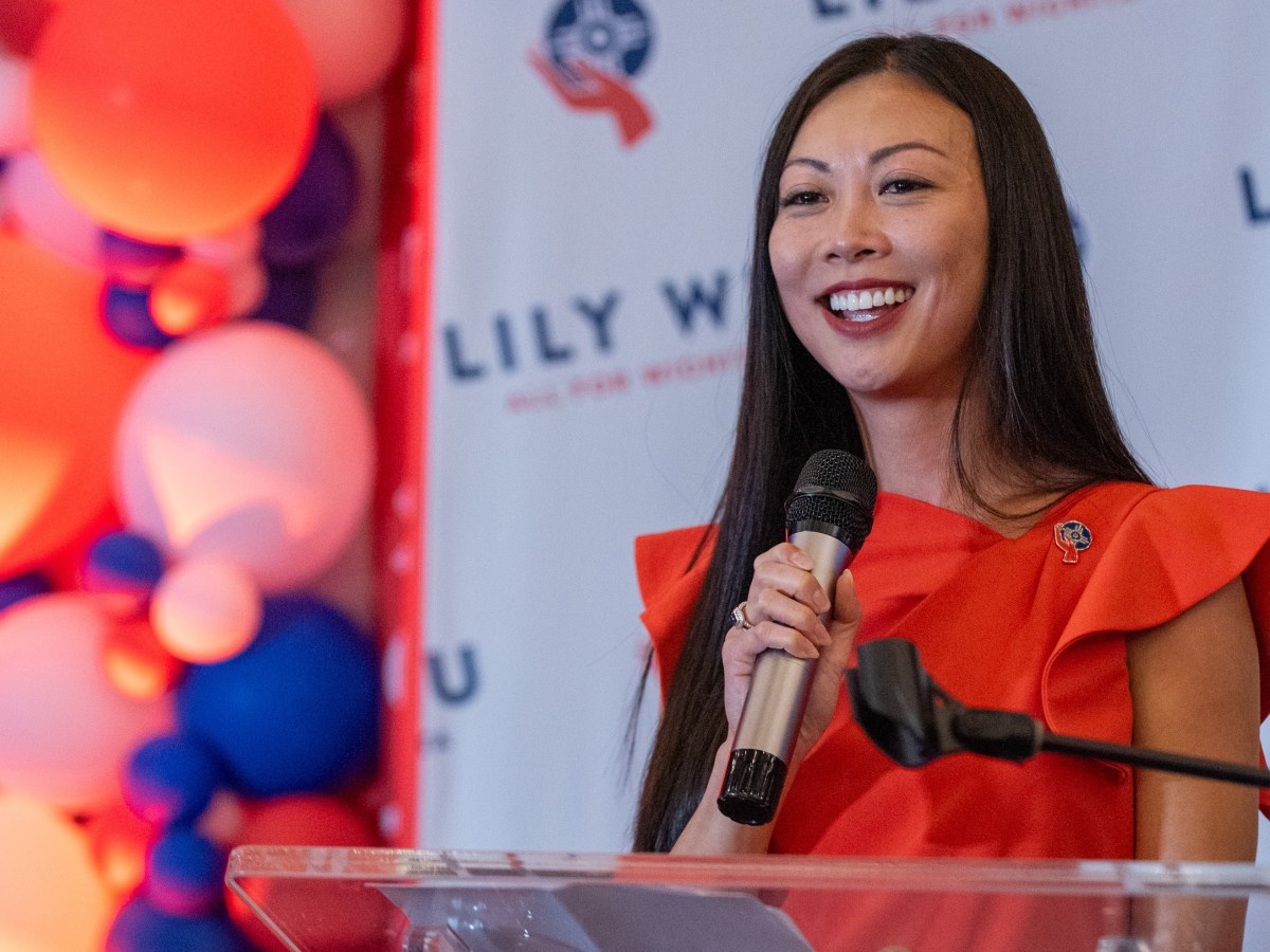 Lily Wu at a podium.