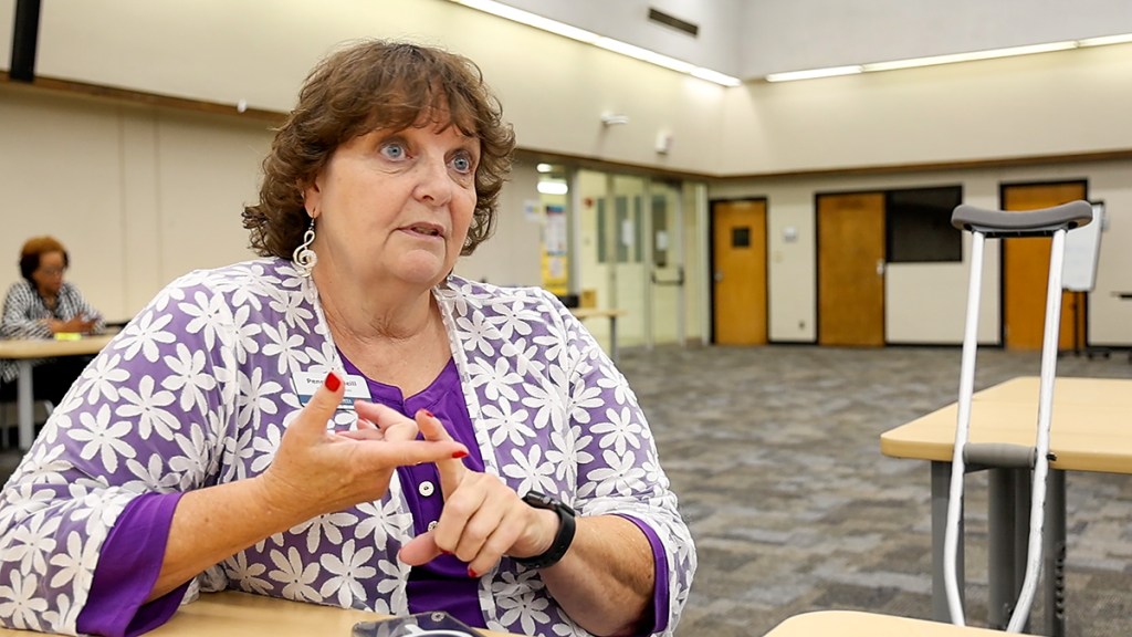 A woman talks about her job of finding substitute teachers.