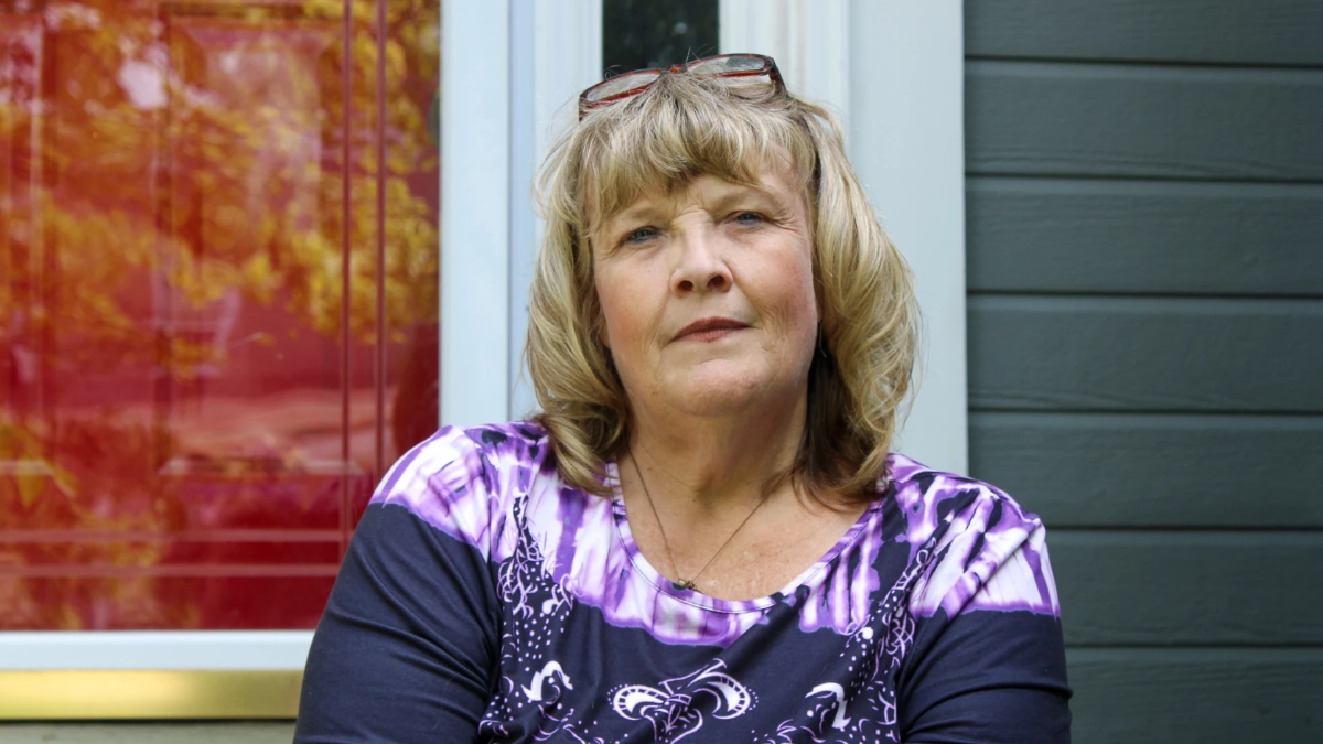 a woman with blonde hair wearing a purple top. kansas nursing homes